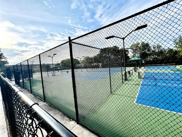 a balcony with view of trees in the background