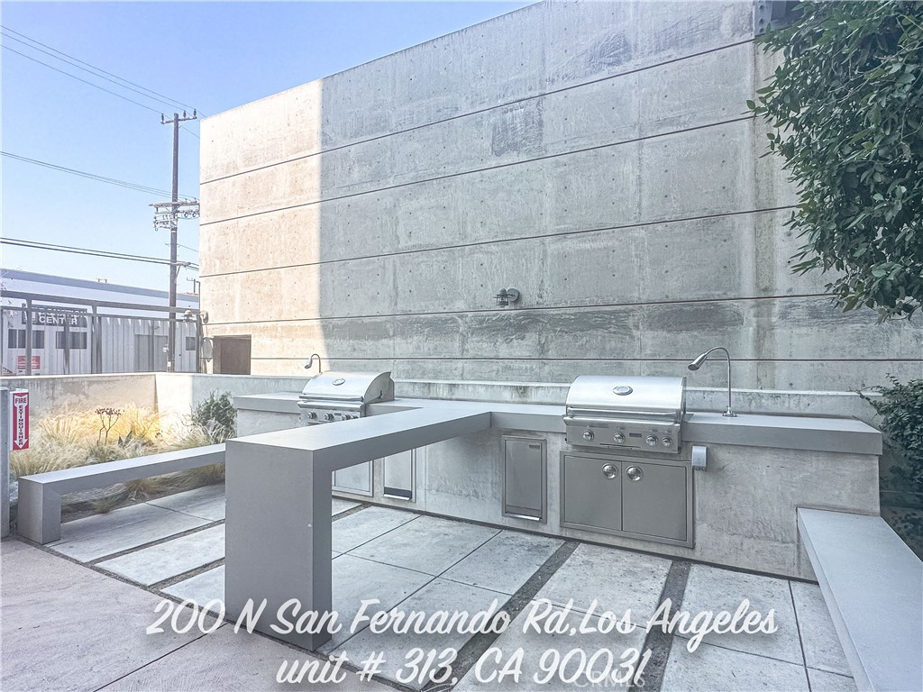 200 North San Fernando Road, Unit 313 Los Angeles, CA 90031 - Photo 22 of 29 a kitchen with a sink and cabinets