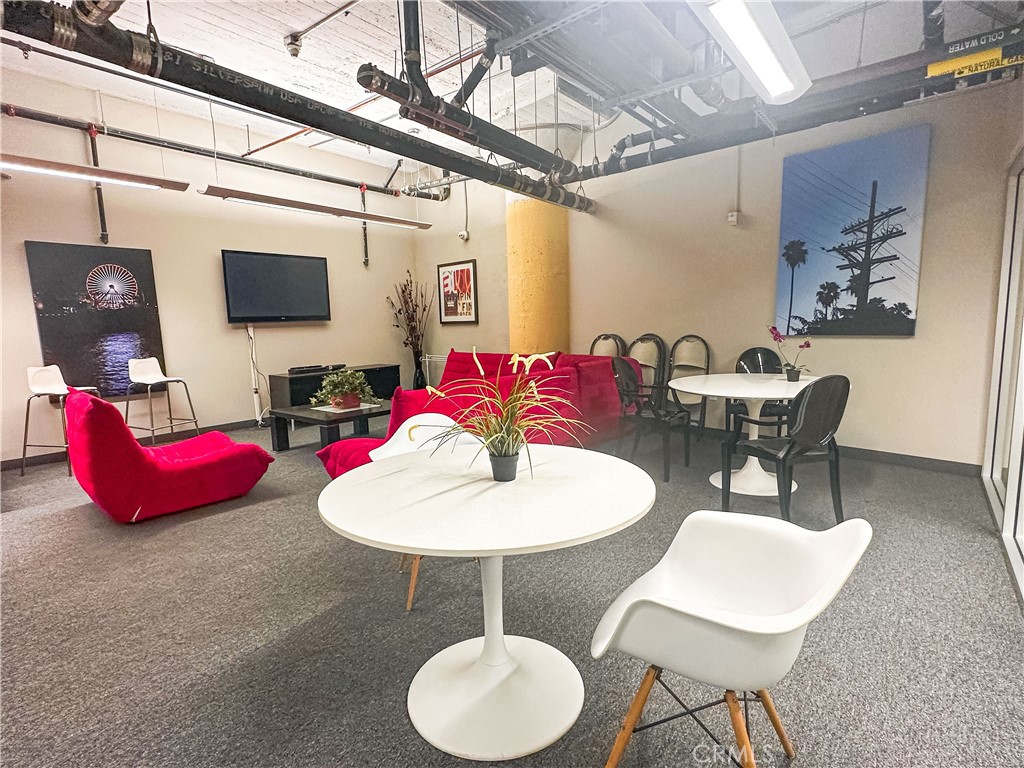 200 North San Fernando Road, Unit 313 Los Angeles, CA 90031 - Photo 26 of 29 a dining room with furniture and wooden floor