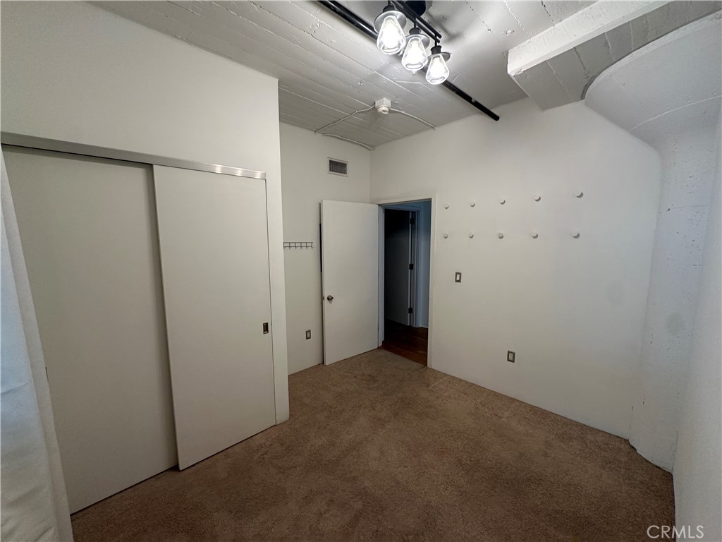 200 North San Fernando Road, Unit 313 Los Angeles, CA 90031 - Photo 9 of 29 an empty room with windows and fan
