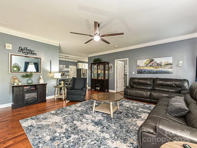 a living room with furniture and a rug