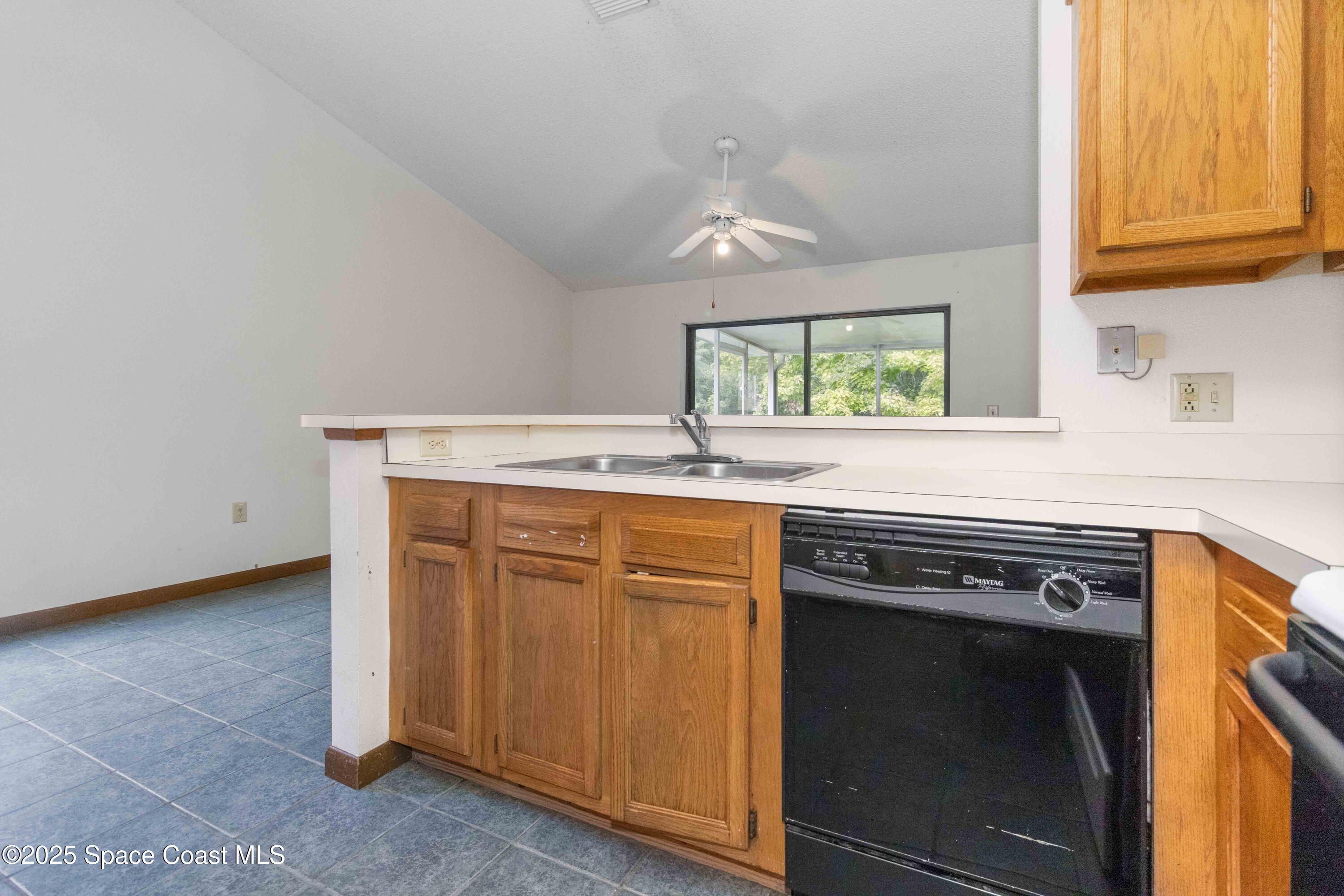 1873 Longleaf Road Cocoa, FL 32926 - Photo 13 of 30 a kitchen with stainless steel appliances granite countertop a sink and a microwave