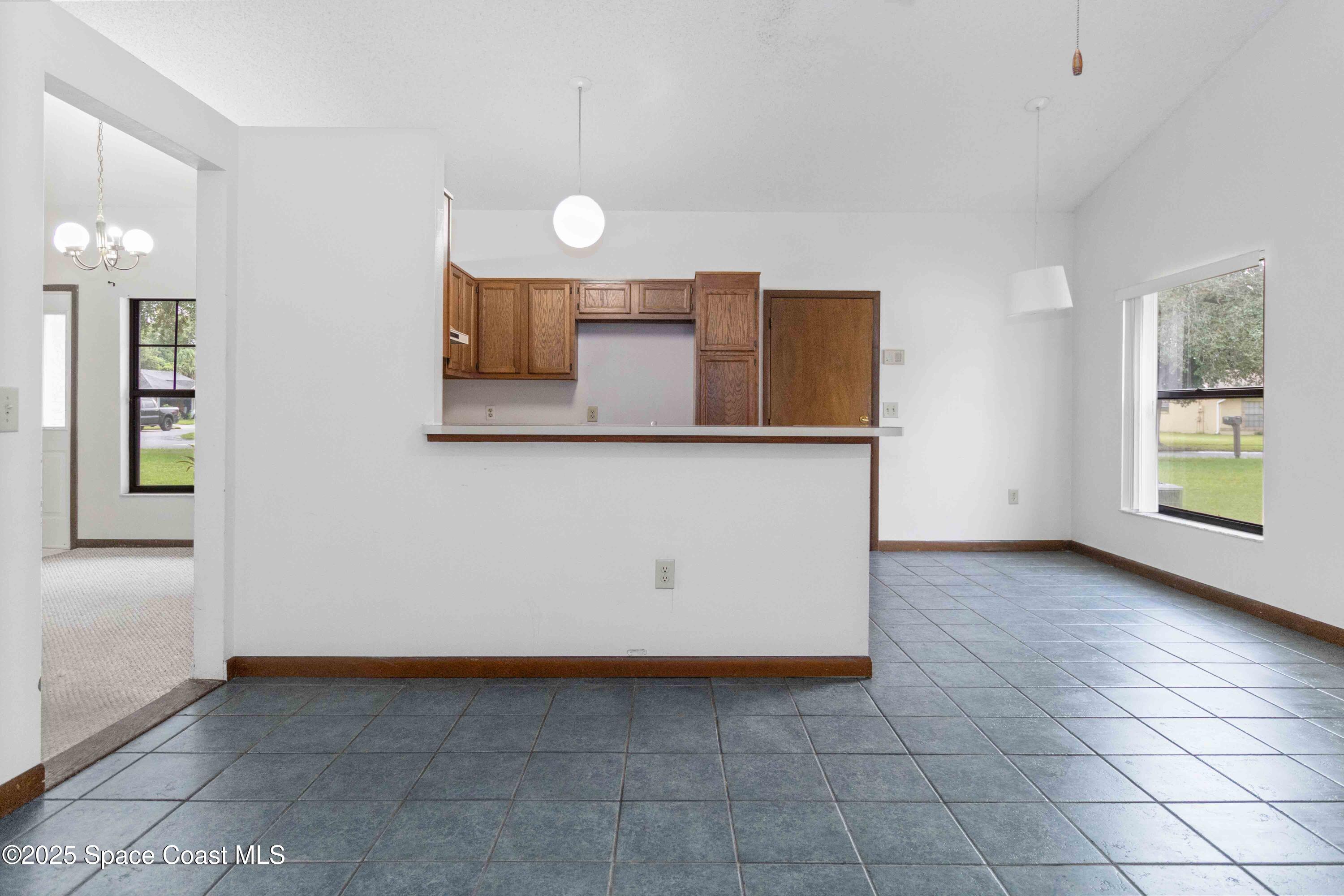 1873 Longleaf Road Cocoa, FL 32926 - Photo 14 of 30 a view of a room with wooden floor and cabinet