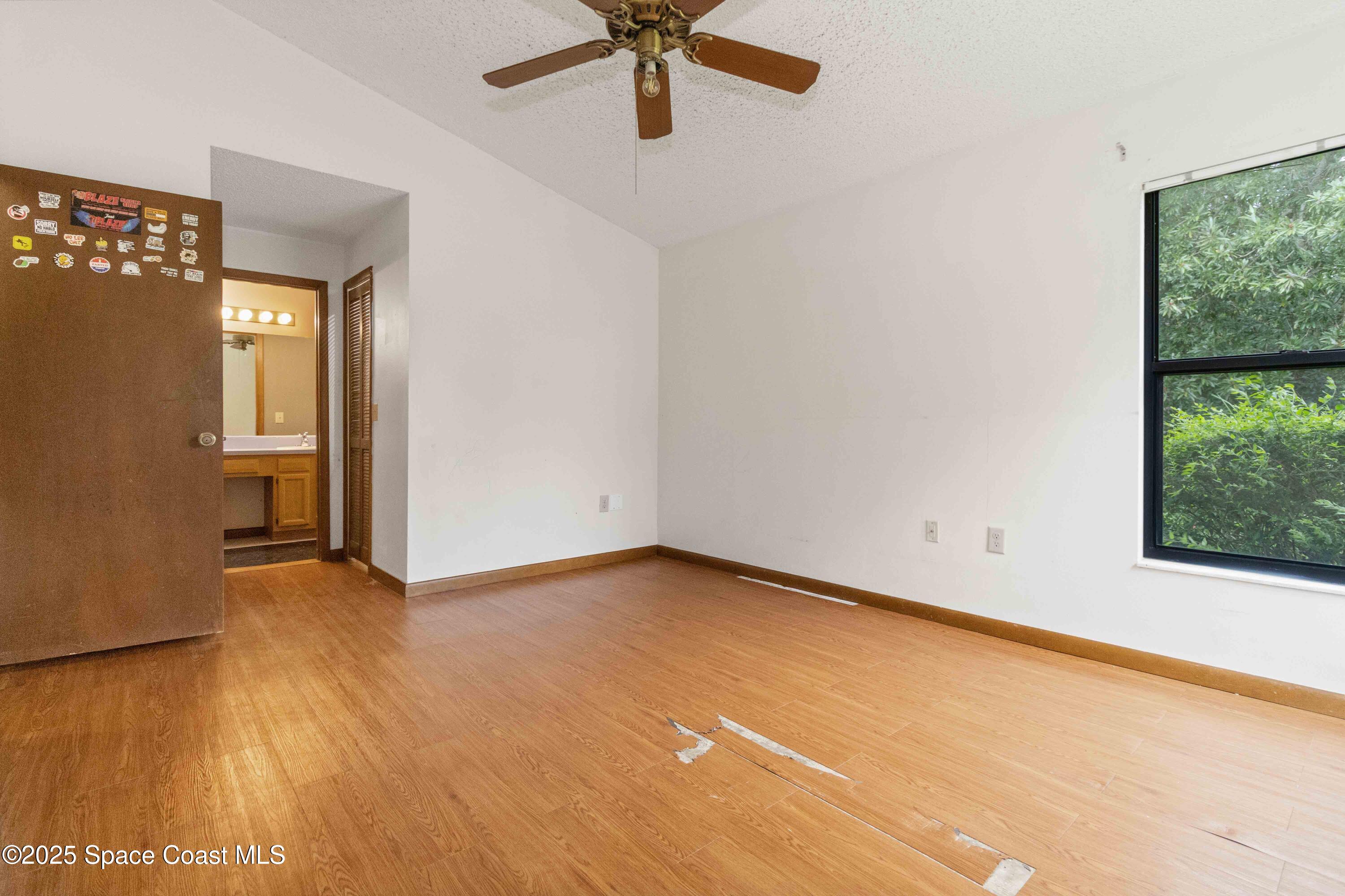 1873 Longleaf Road Cocoa, FL 32926 - Photo 16 of 30 wooden floor in an empty room with a window