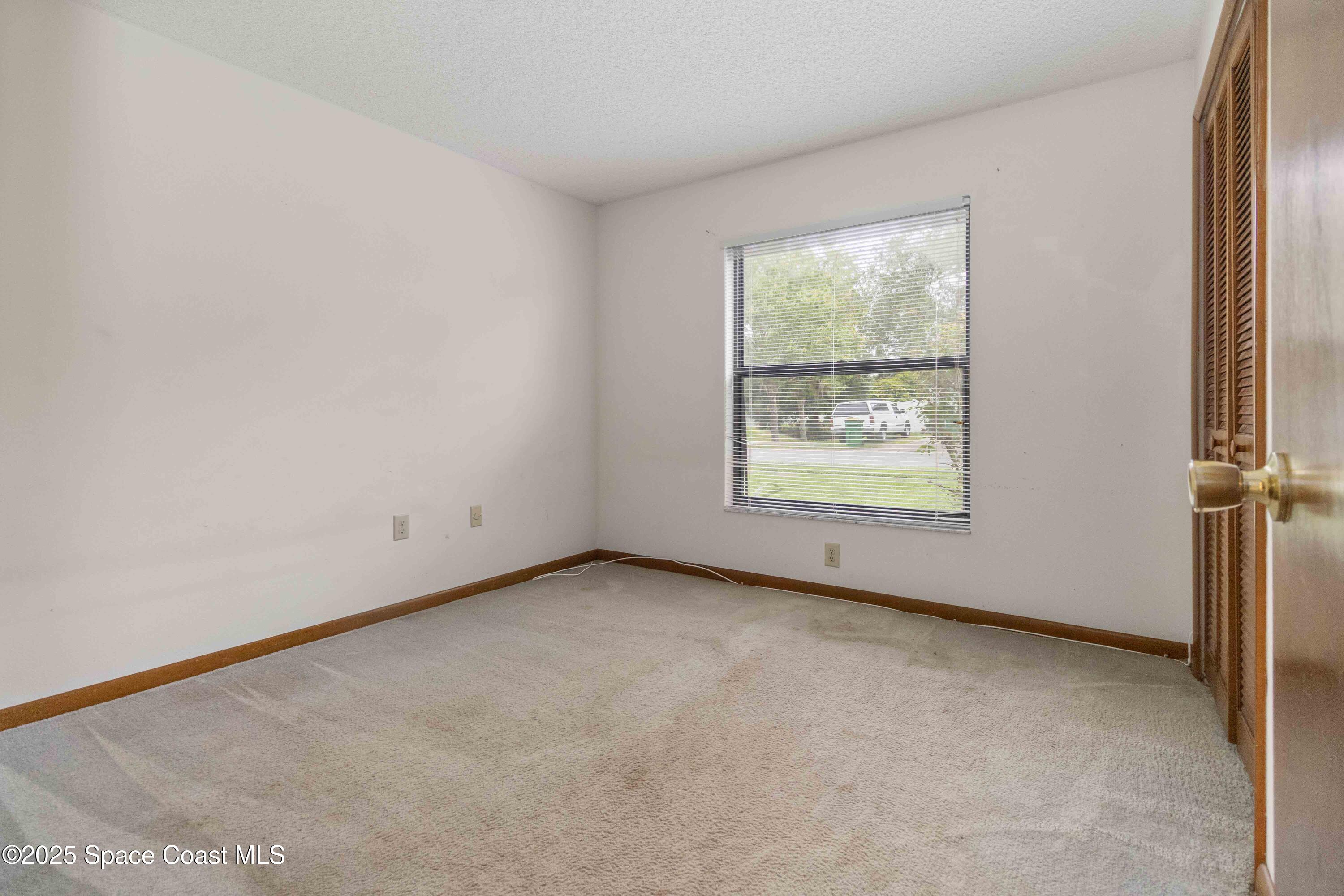 1873 Longleaf Road Cocoa, FL 32926 - Photo 20 of 30 an empty room with windows