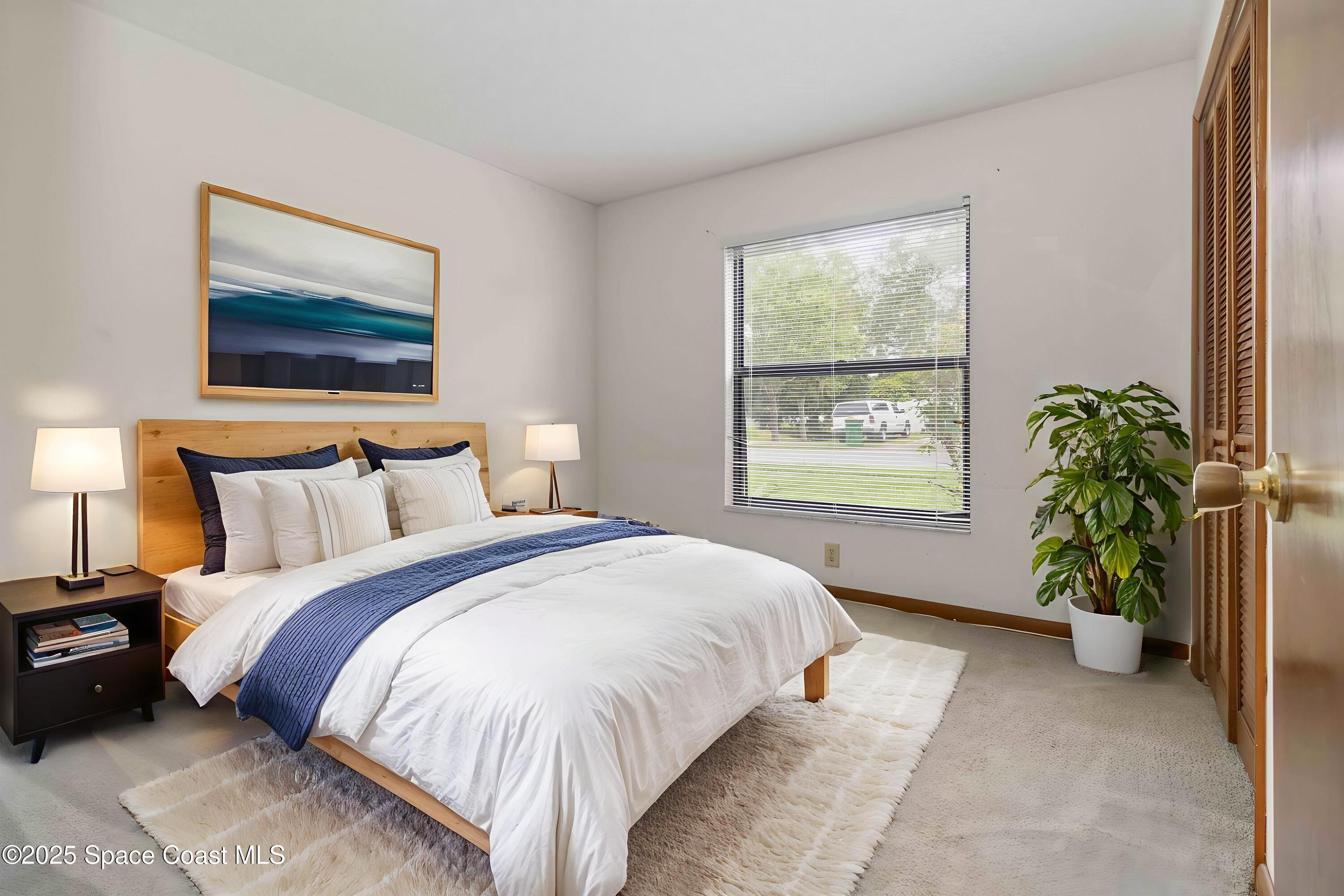 1873 Longleaf Road Cocoa, FL 32926 - Photo 21 of 30 a bedroom with bed and a window