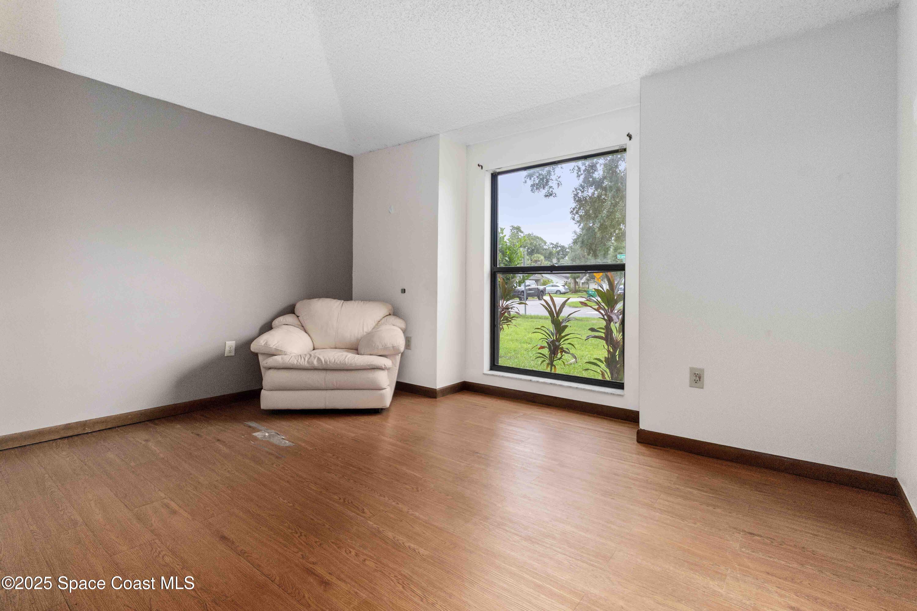 1873 Longleaf Road Cocoa, FL 32926 - Photo 23 of 30 a view of room with window and wooden floor