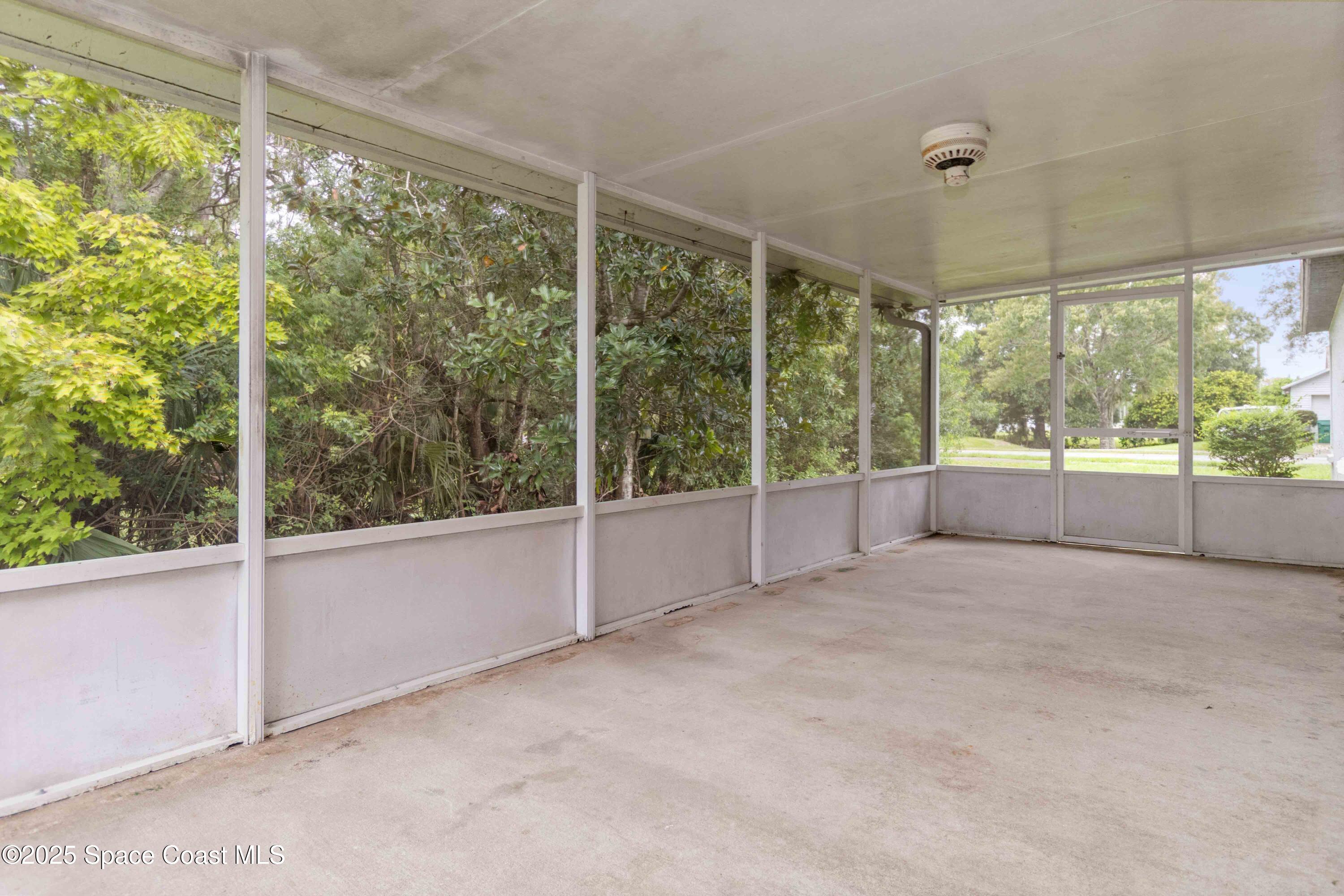 1873 Longleaf Road Cocoa, FL 32926 - Photo 25 of 30 a view of an empty room with windows