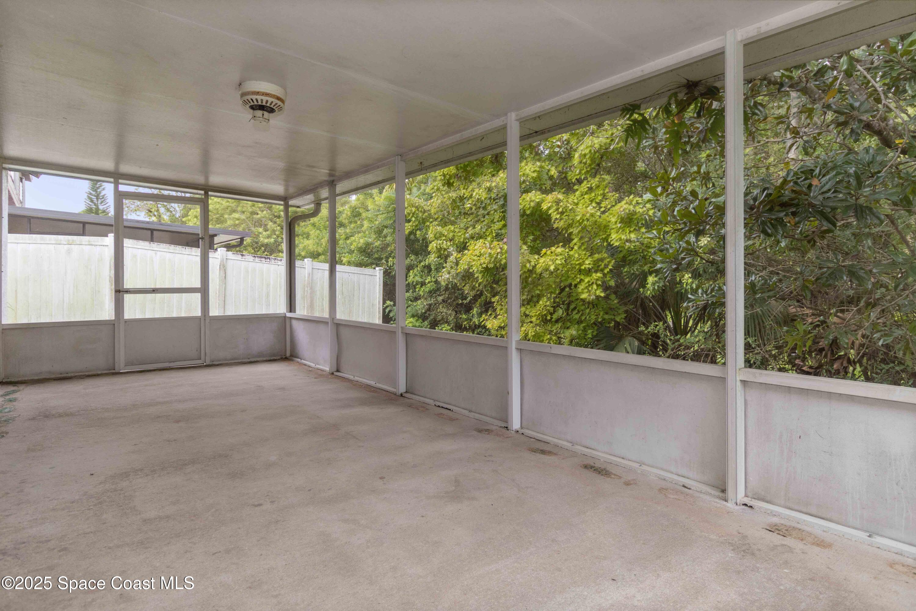 1873 Longleaf Road Cocoa, FL 32926 - Photo 26 of 30 a view of an empty room with a large window