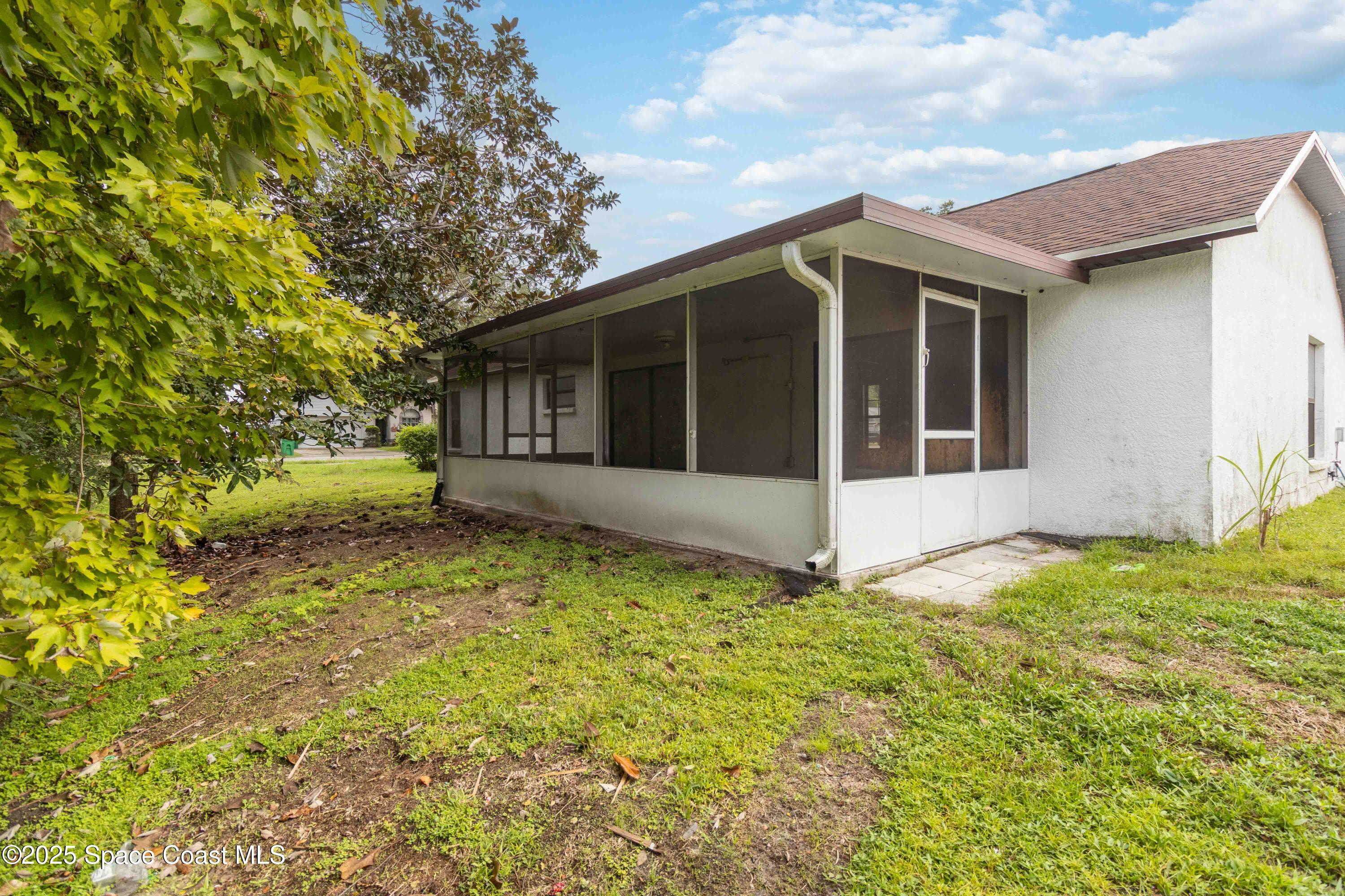 1873 Longleaf Road Cocoa, FL 32926 - Photo 28 of 30 a view of a house with a yard