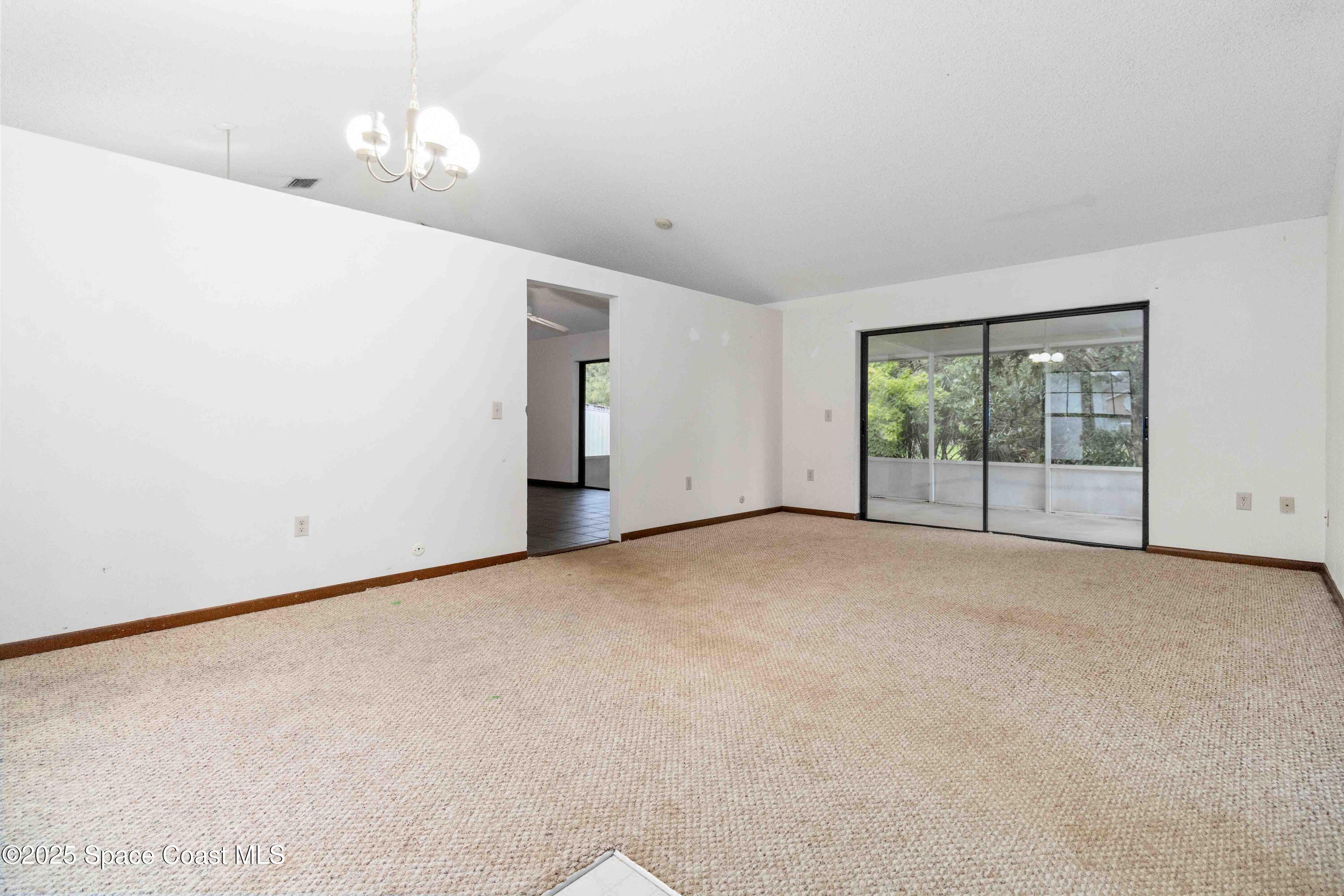 1873 Longleaf Road Cocoa, FL 32926 - Photo 4 of 30 a view of an empty room with a window
