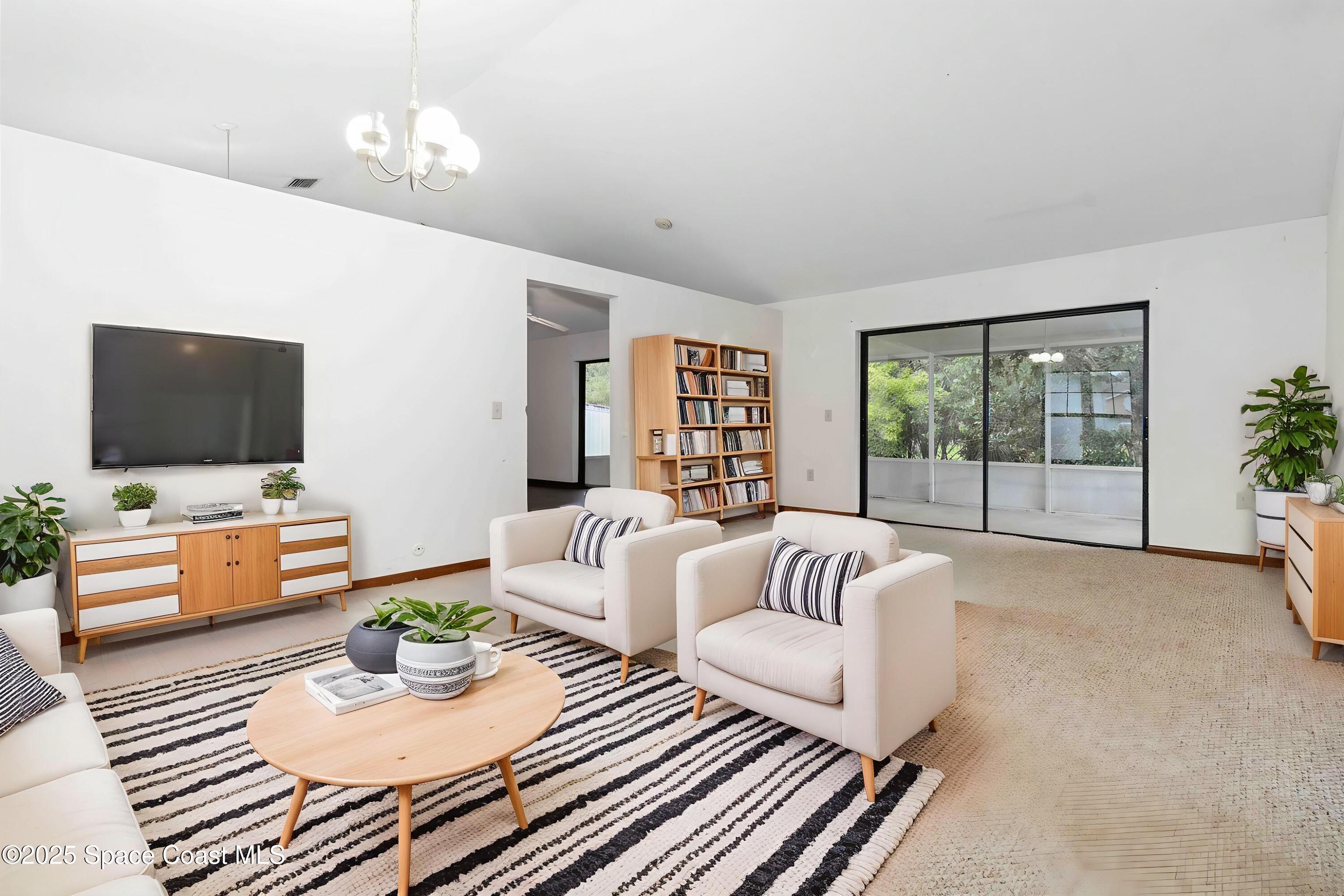 1873 Longleaf Road Cocoa, FL 32926 - Photo 5 of 30 a living room with furniture and a flat screen tv