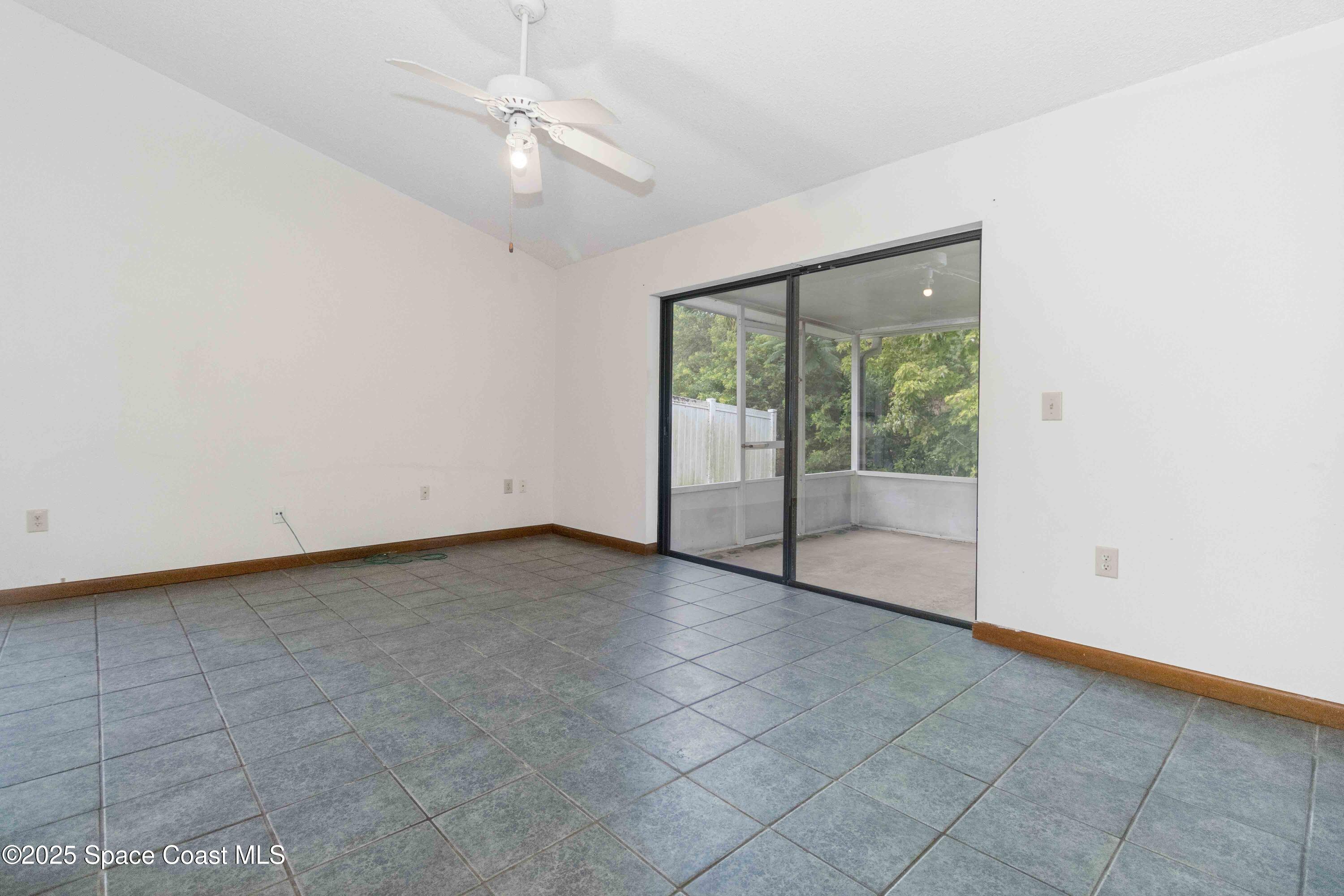 1873 Longleaf Road Cocoa, FL 32926 - Photo 7 of 30 an empty room with windows and outdoor view