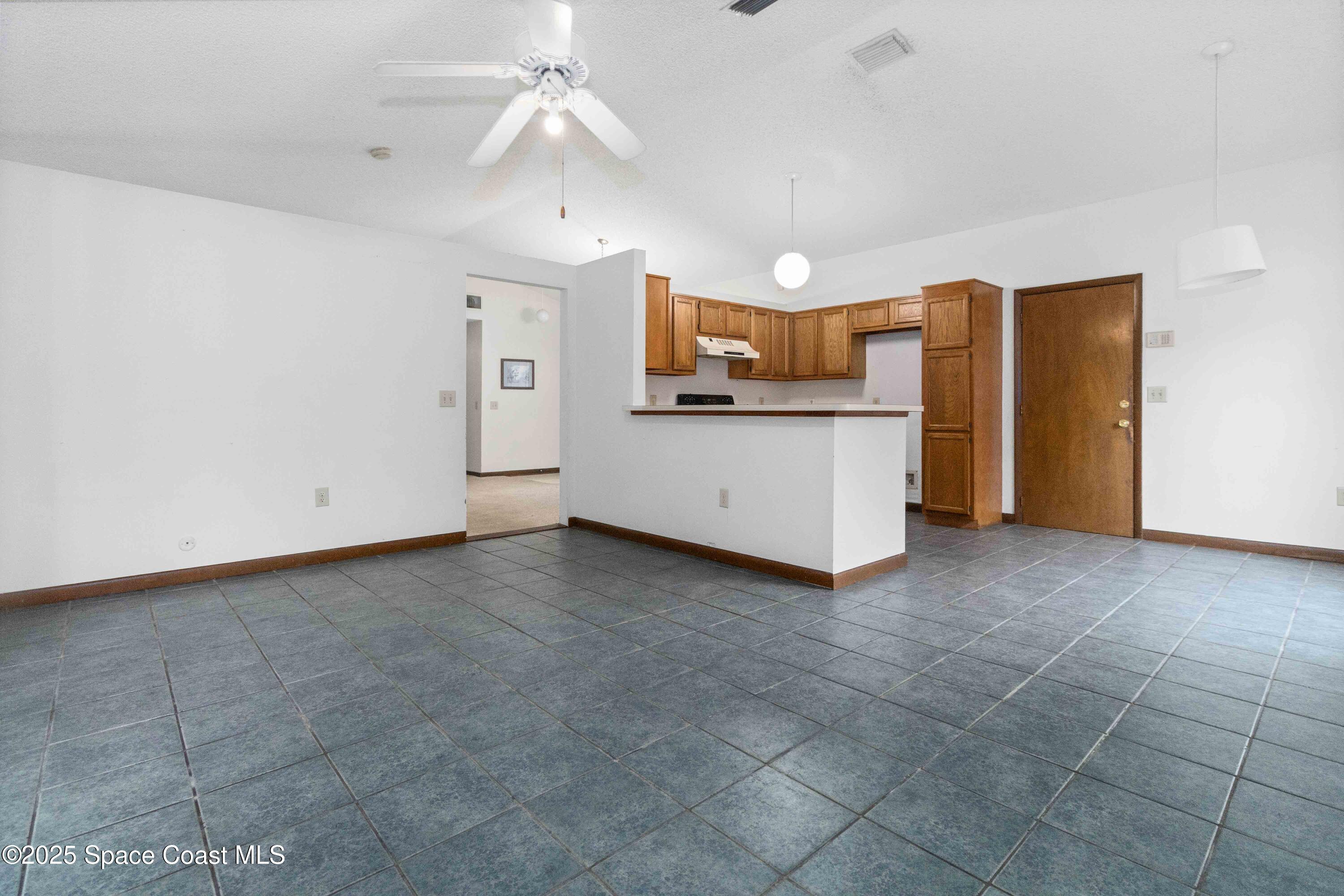 1873 Longleaf Road Cocoa, FL 32926 - Photo 8 of 30 a view of a kitchen with a sink and cabinet area