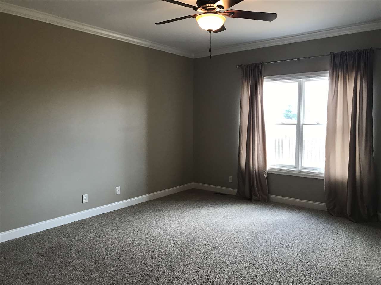 2840 Hamson Way Belvidere, IL 61008 - Photo 12 of 24 an empty room with a window and a fan