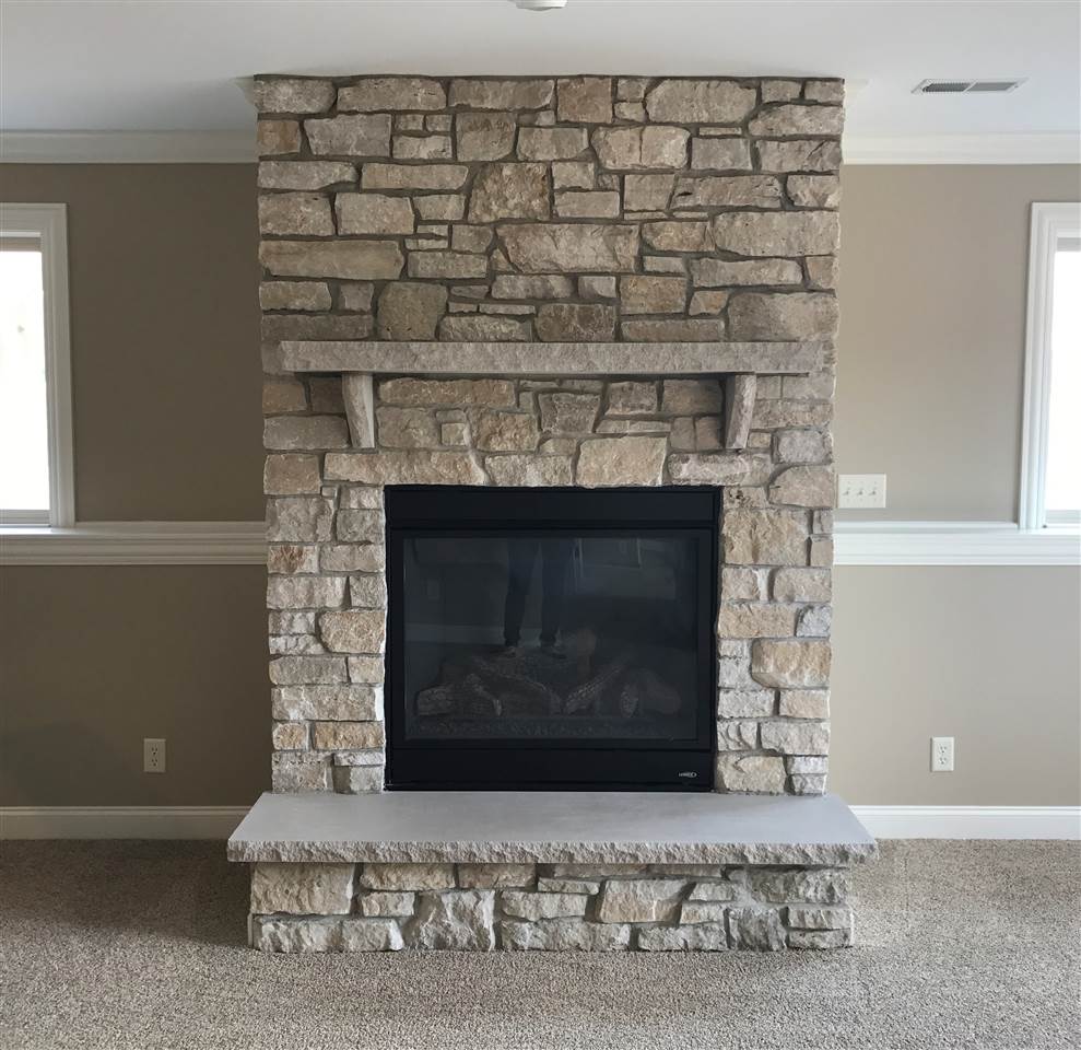 2840 Hamson Way Belvidere, IL 61008 - Photo 21 of 24 a living room with a fireplace