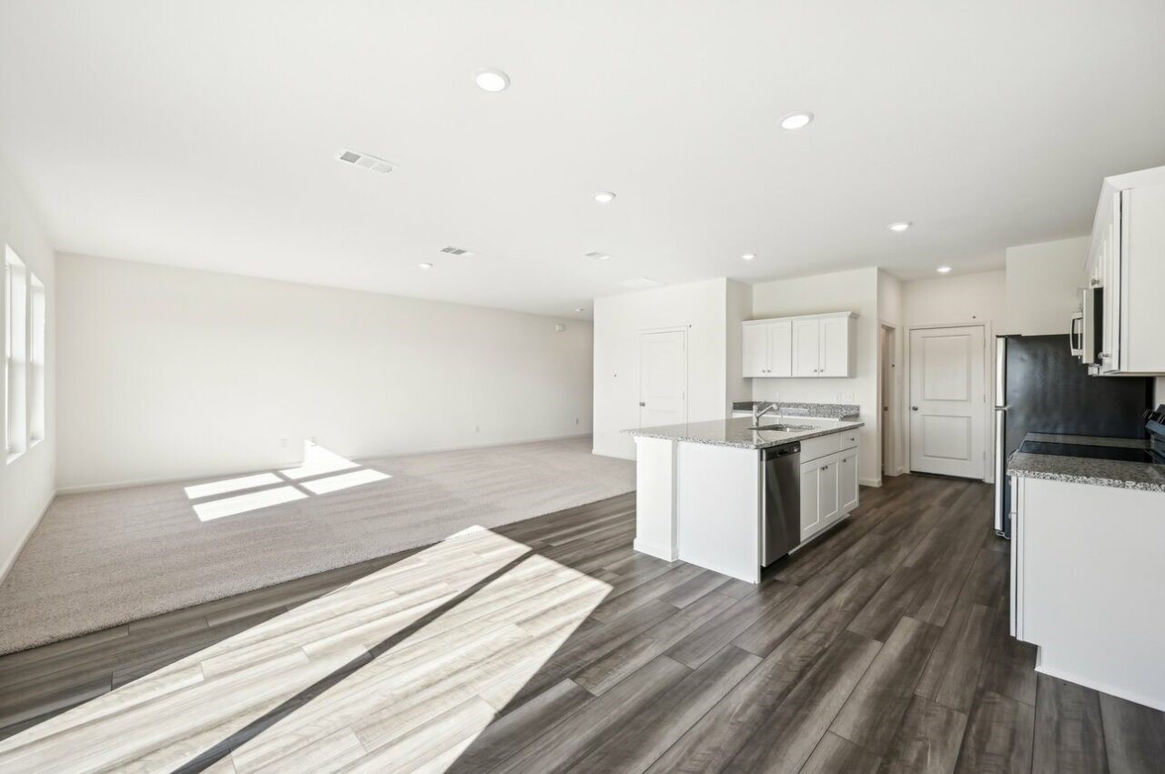9349 Beryl Lane Conroe, TX 77303 - Photo 3 of 9 a kitchen with a refrigerator and a stove top oven