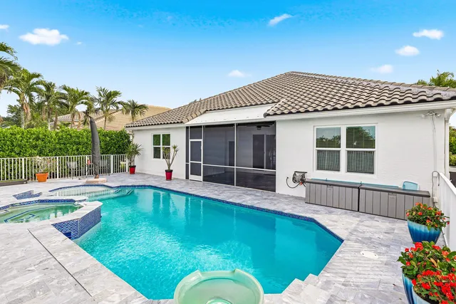 a kitchen with granite countertop white cabinets white stainless steel appliances with a sink and dishwasher