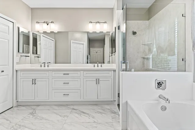 a bathroom with a sink a toilet and a bathtub