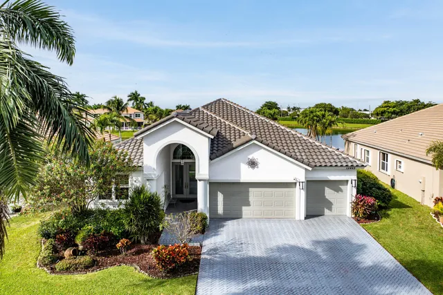 an aerial view of a house with a garden