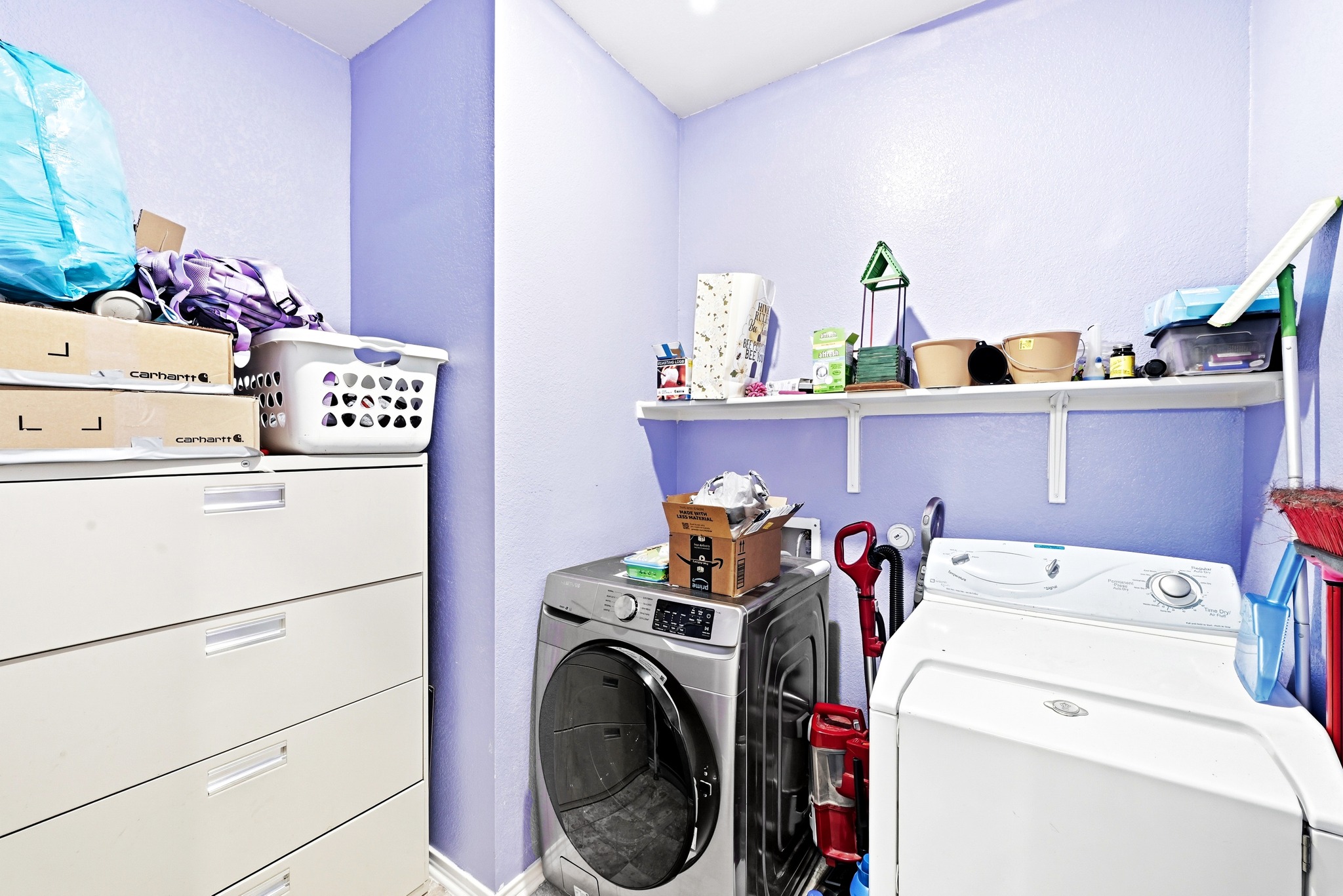 1621 Dragonfly Loop Bastrop, TX 78602 - Photo 22 of 27 Utility room with light purple walls