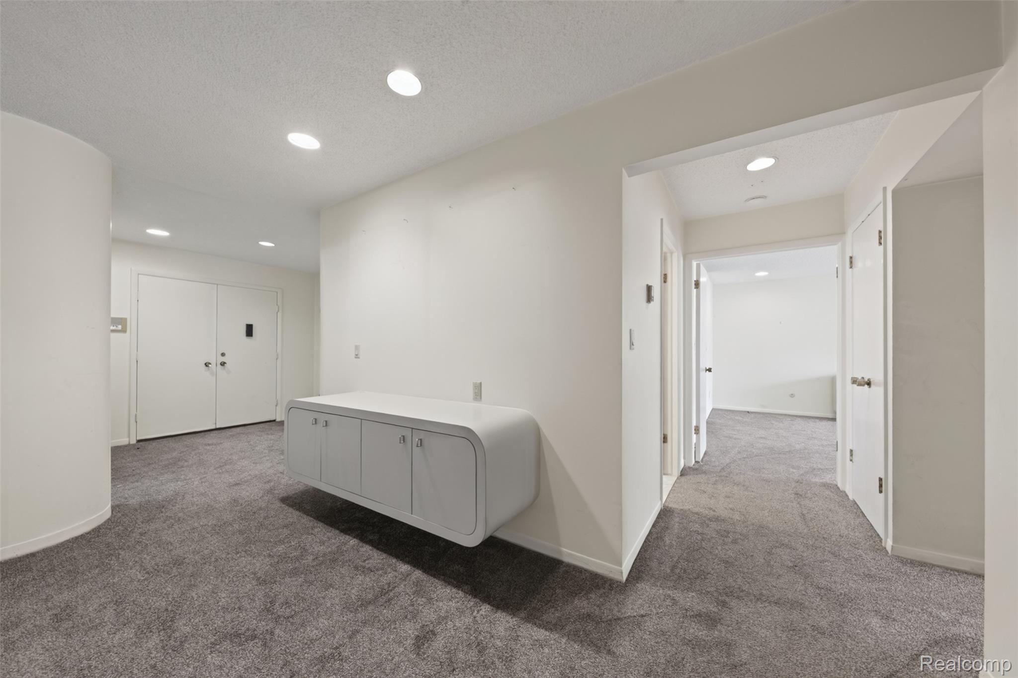 31915 West 14 Mile Road Farmington, MI 48334 - Photo 26 of 47 Recessed ceiling lighting, wall-mounted cabinetry, textured carpeting, and multiple doorways