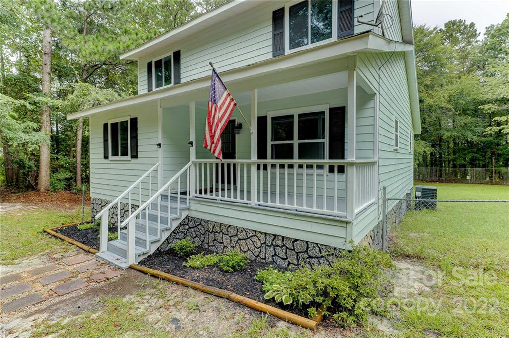 2050 Haire Road Fort Mill, SC 29715 - Photo 1 of 34 a view of a house with a small yard and wooden fence