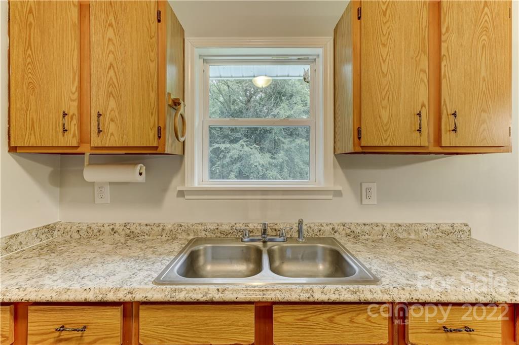 2050 Haire Road Fort Mill, SC 29715 - Photo 14 of 34 a kitchen with granite countertop a sink and granite counter tops