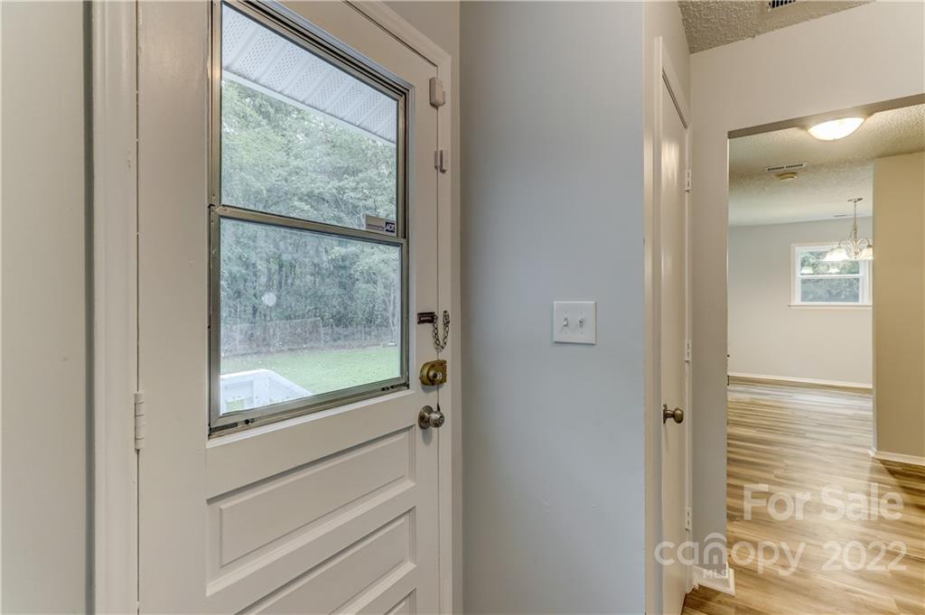 2050 Haire Road Fort Mill, SC 29715 - Photo 16 of 34 a view of a hallway with a glass door and shower