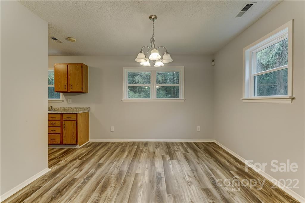 2050 Haire Road Fort Mill, SC 29715 - Photo 8 of 34 wooden floor in an empty room with a window