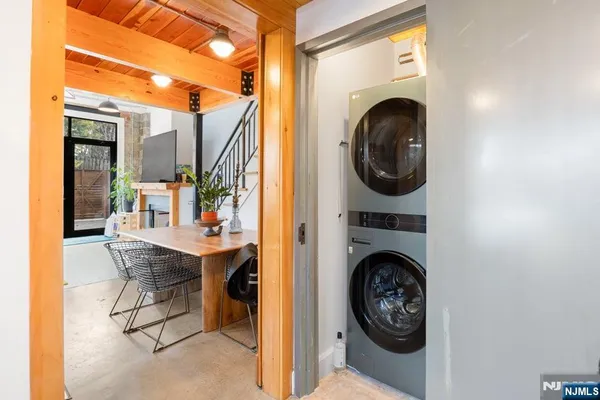 a view of a hallway with washer and dryer