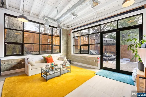 a living room with furniture and a large window