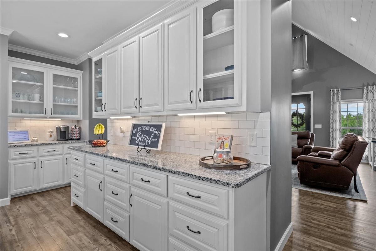 3571 Old Blacktop Road McEwen, TN 37101 - Photo 20 of 99 a kitchen with granite countertop a sink stove and cabinets