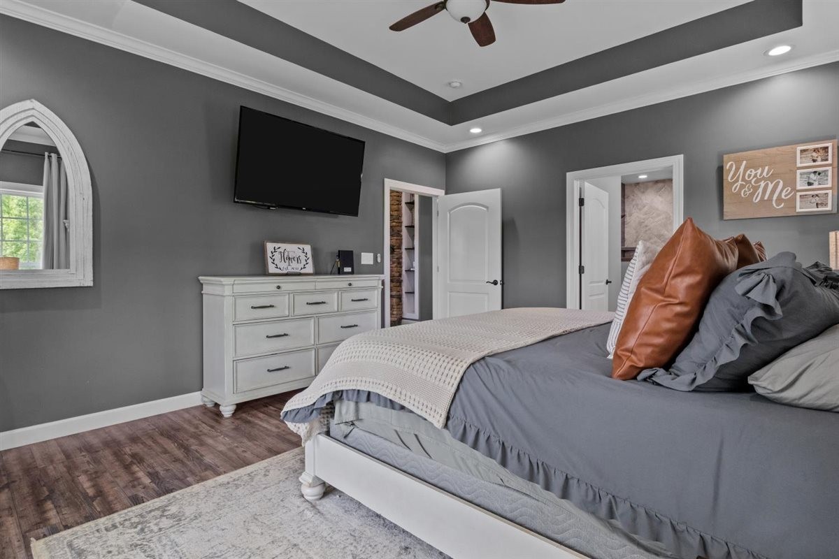 3571 Old Blacktop Road McEwen, TN 37101 - Photo 28 of 99 a bedroom with a bed and a flat screen tv