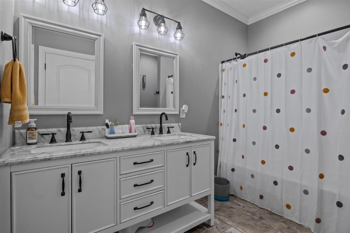 3571 Old Blacktop Road McEwen, TN 37101 - Photo 36 of 99 a bathroom with a double vanity sink and a mirror