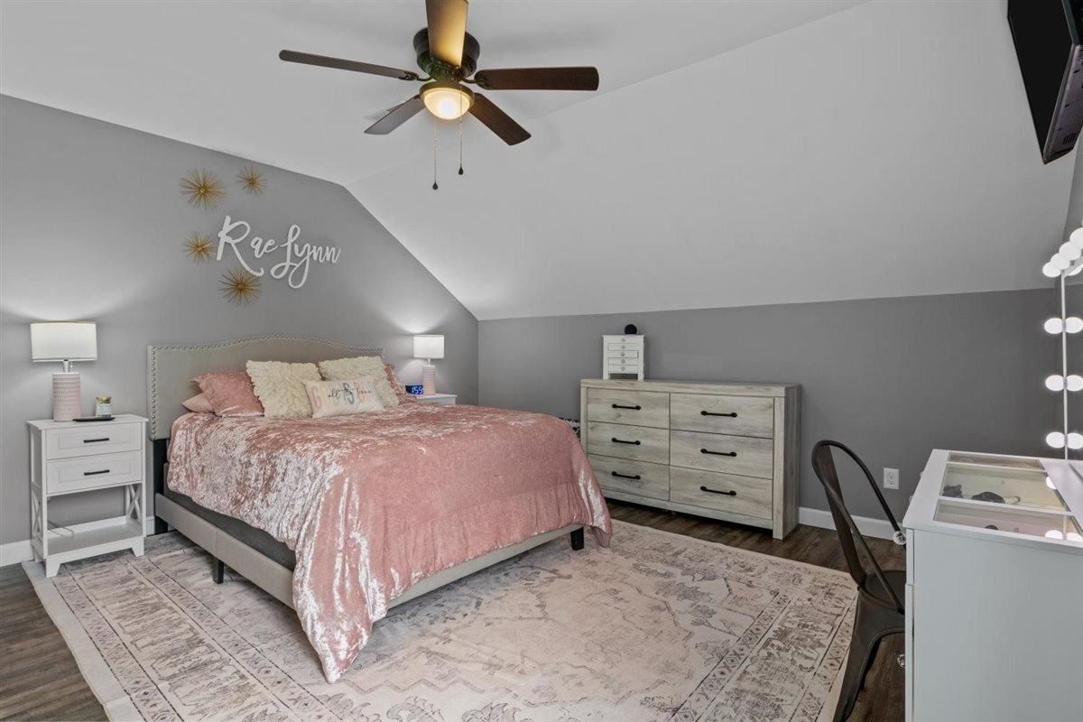 3571 Old Blacktop Road McEwen, TN 37101 - Photo 43 of 99 a bedroom with a bed and a chandelier