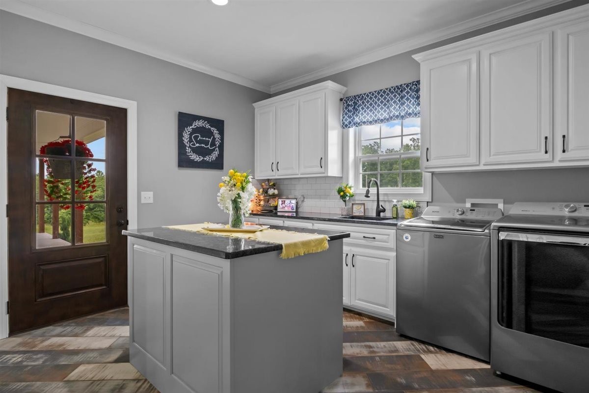3571 Old Blacktop Road McEwen, TN 37101 - Photo 46 of 99 a kitchen with granite countertop a sink stove and cabinets