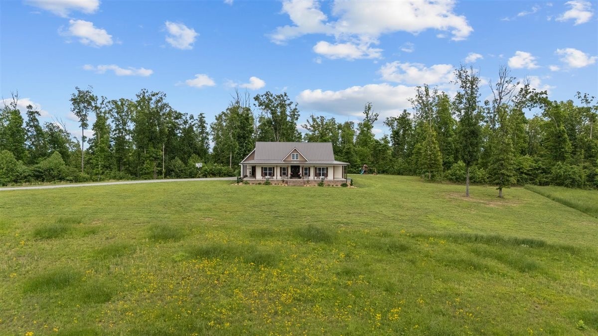3571 Old Blacktop Road McEwen, TN 37101 - Photo 57 of 99 a view of a green field with house in the background