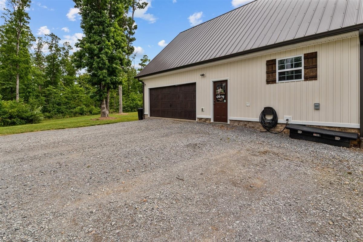 3571 Old Blacktop Road McEwen, TN 37101 - Photo 59 of 99 a view of a house with backyard and trees