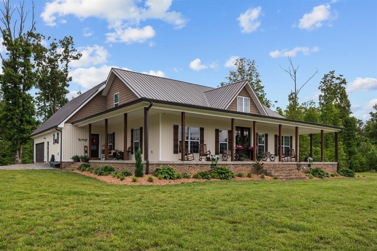 3571 Old Blacktop Road McEwen, TN 37101 - Photo 6 of 99 a front view of house with yard and outdoor seating