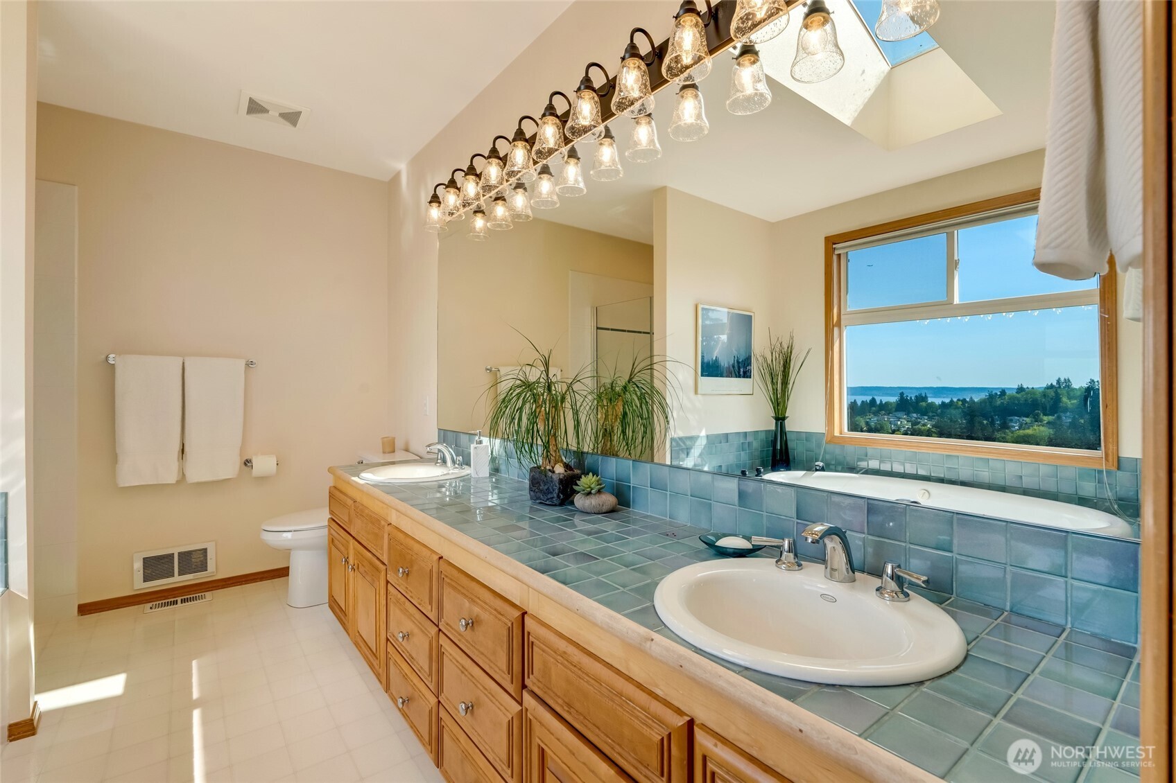 4920 Seahurst Avenue Everett, WA 98203 - Photo 29 of 39 a bathroom with a double vanity sink and a mirror