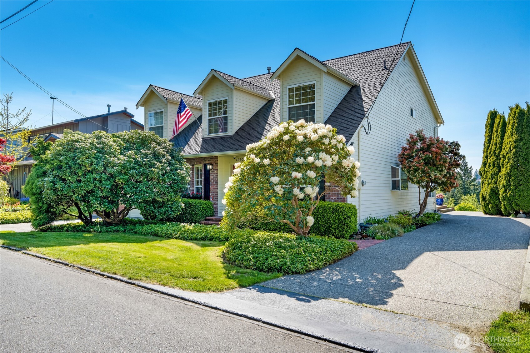 4920 Seahurst Avenue Everett, WA 98203 - Photo 3 of 39 a front view of a house with a yard and garage