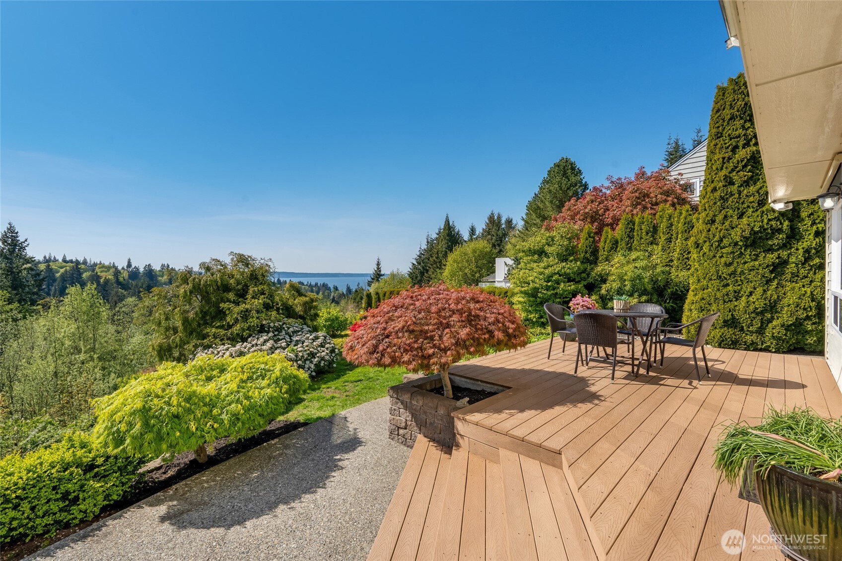 4920 Seahurst Avenue Everett, WA 98203 - Photo 33 of 39 a view of a patio with table and chairs and potted plants