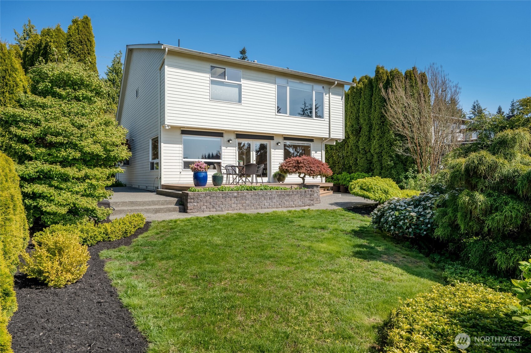 4920 Seahurst Avenue Everett, WA 98203 - Photo 37 of 39 a view of a house with a backyard and a garden