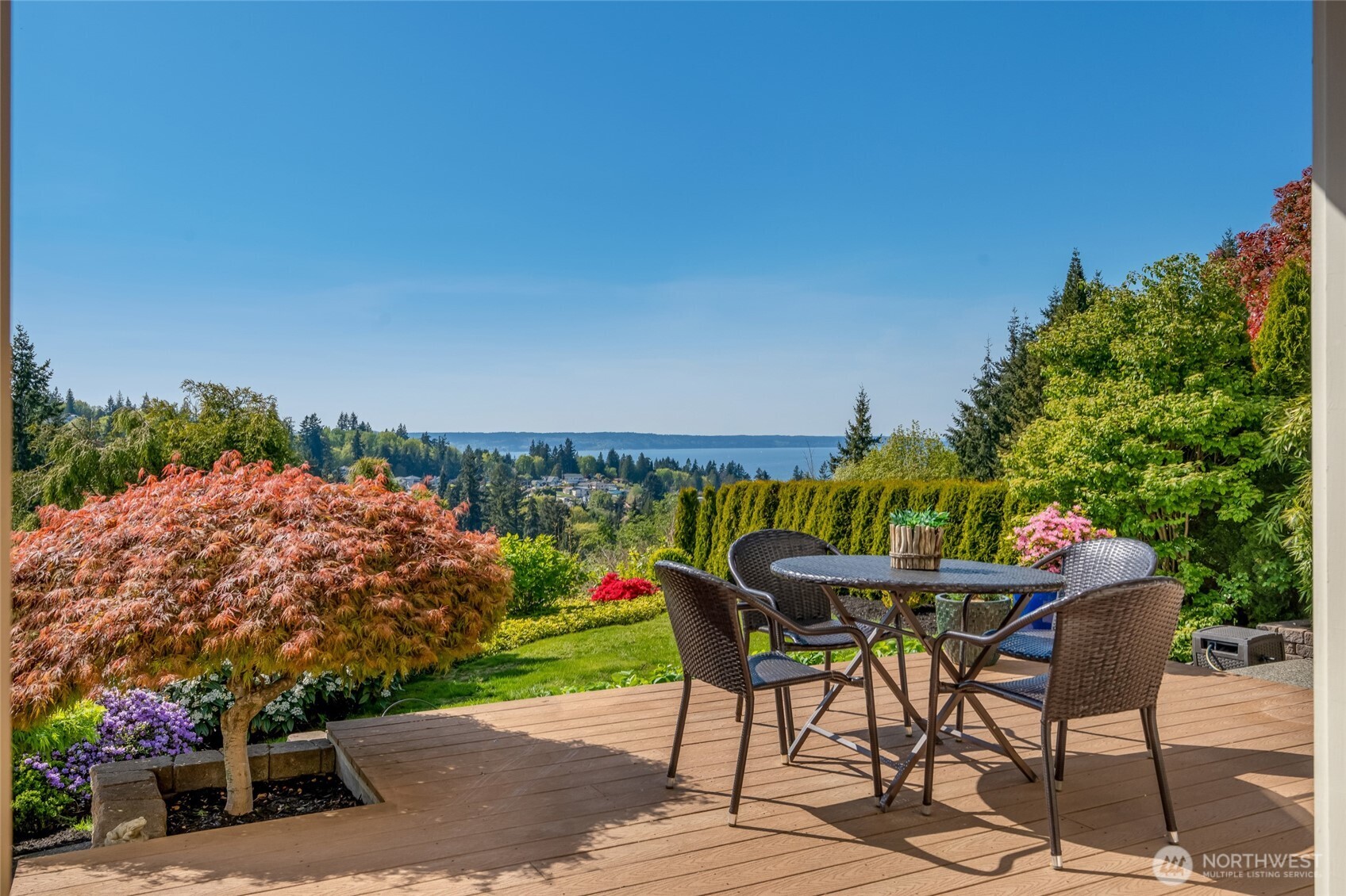 4920 Seahurst Avenue Everett, WA 98203 - Photo 6 of 39 a patio with table and chairs and potted plants with sky view