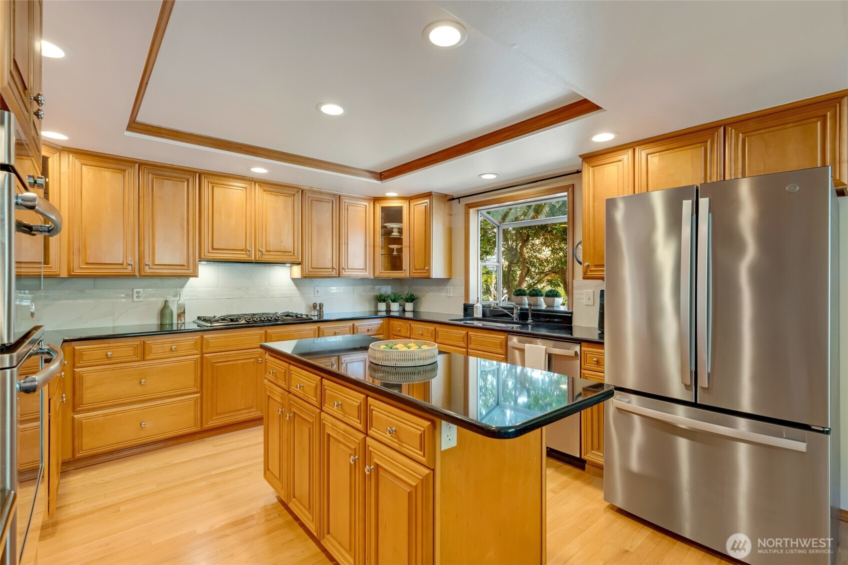 4920 Seahurst Avenue Everett, WA 98203 - Photo 10 of 39 a kitchen with stainless steel appliances granite countertop a refrigerator a sink and a stove