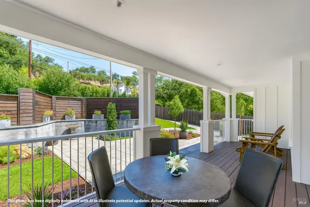 a living room with furniture a flat screen tv and a large window