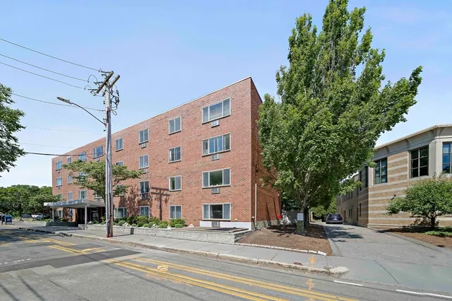 a view of a building along a street