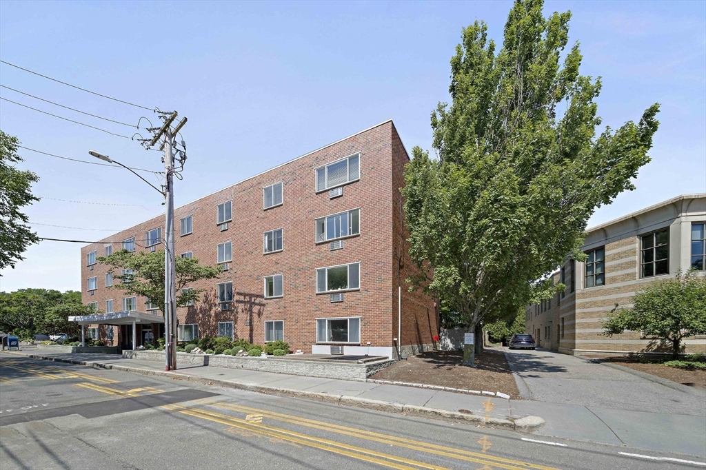 50 Green Brookline Ma, Unit 411 Brookline, MA 02446 - Photo 2 of 9 a view of a building along a street