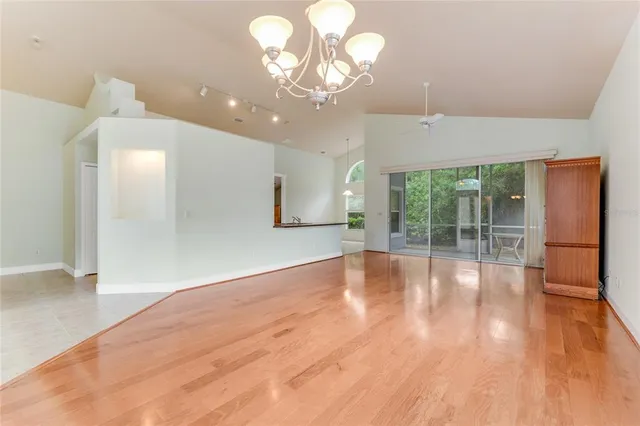 a kitchen with stainless steel appliances granite countertop a sink a stove a refrigerator and a oven